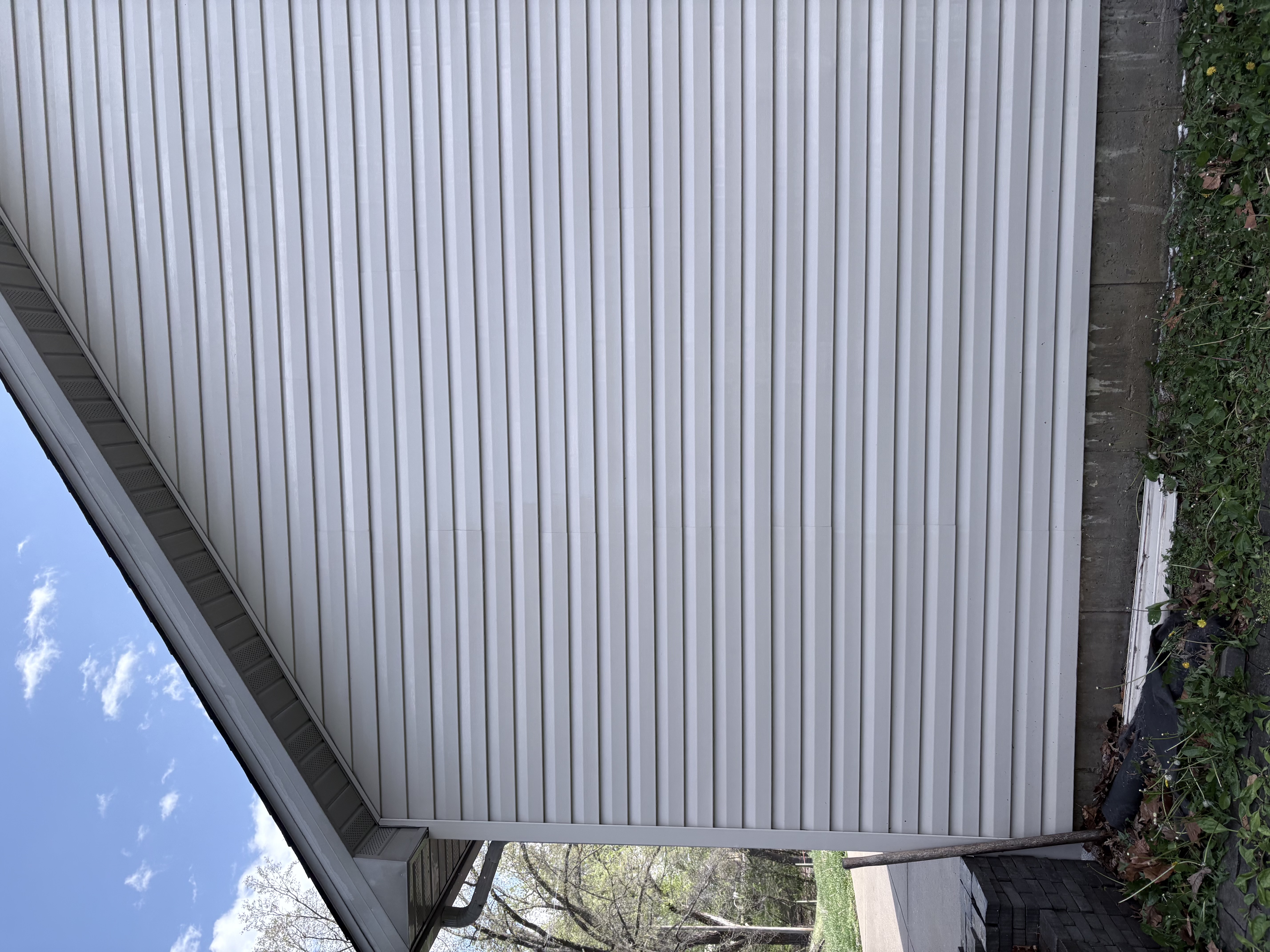 House siding after soft wash — clean white finish